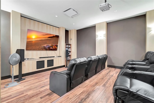 home theater with light wood-type flooring