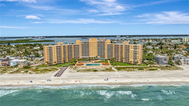 aerial view with a water view and a beach view