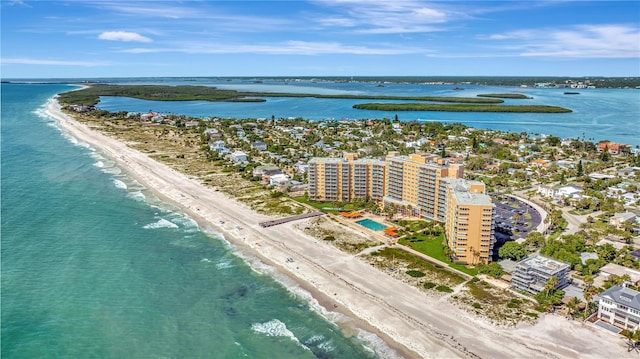 birds eye view of property with a view of city, a water view, and a beach view