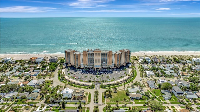 aerial view featuring a view of the beach and a water view