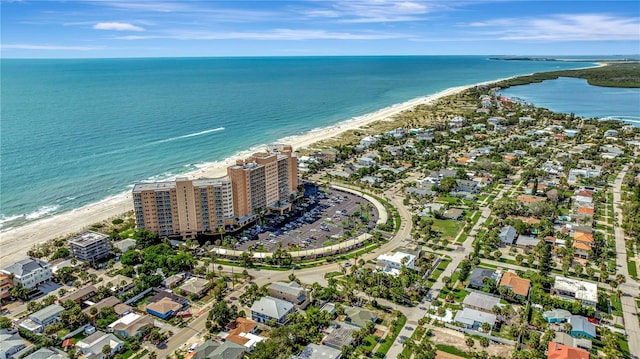 drone / aerial view with a water view and a view of the beach