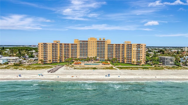 aerial view featuring a view of the beach and a water view