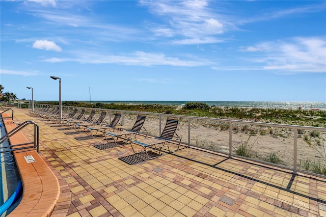 view of patio with a water view