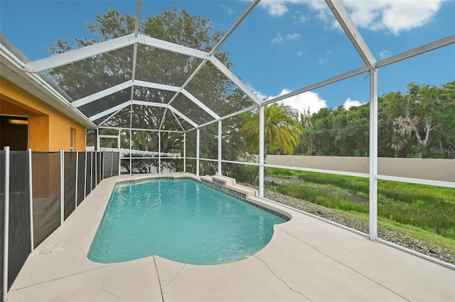 view of pool featuring a patio and a lanai