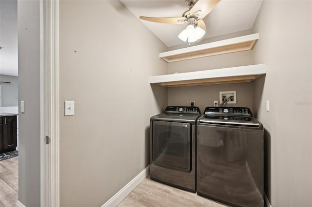 washroom with separate washer and dryer, ceiling fan, and light hardwood / wood-style flooring