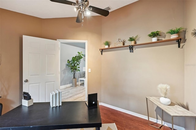 home office with hardwood / wood-style floors and ceiling fan