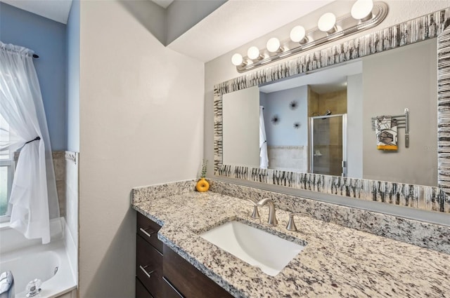 bathroom featuring vanity and independent shower and bath