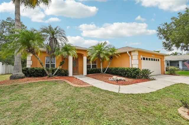 view of front of property featuring a garage and a front lawn