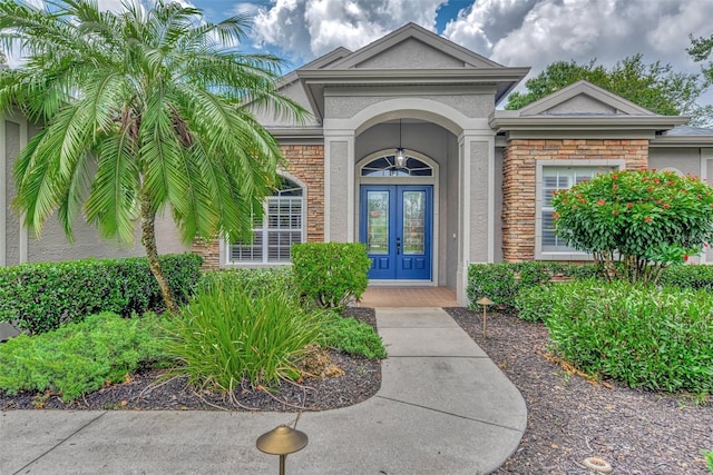 view of exterior entry featuring french doors