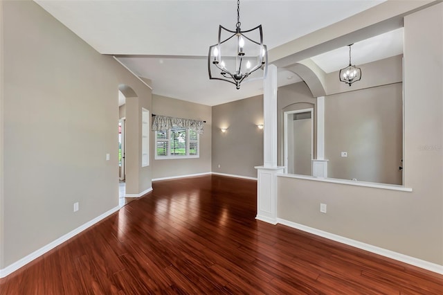 unfurnished dining area featuring hardwood / wood-style floors and an inviting chandelier