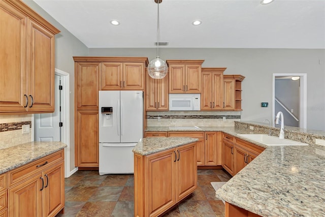 kitchen featuring sink, hanging light fixtures, tasteful backsplash, light stone counters, and white appliances