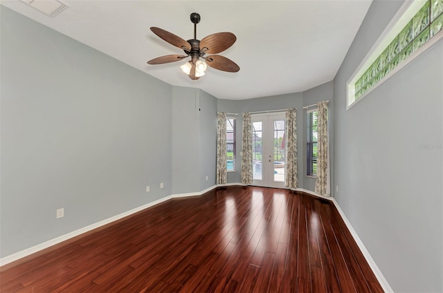 unfurnished room featuring french doors, hardwood / wood-style flooring, and ceiling fan