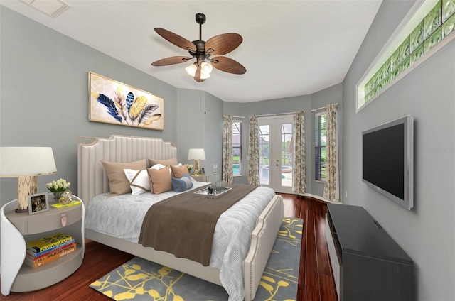 bedroom with access to outside, ceiling fan, french doors, and dark wood-type flooring