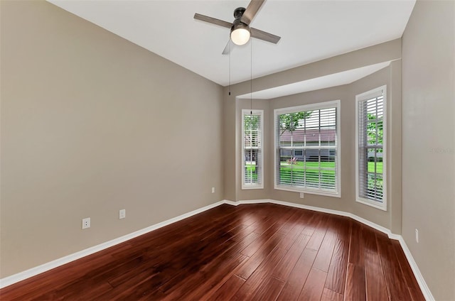 unfurnished room with hardwood / wood-style flooring and ceiling fan