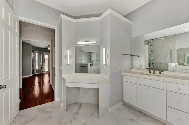 bathroom with walk in shower, vanity, and ceiling fan