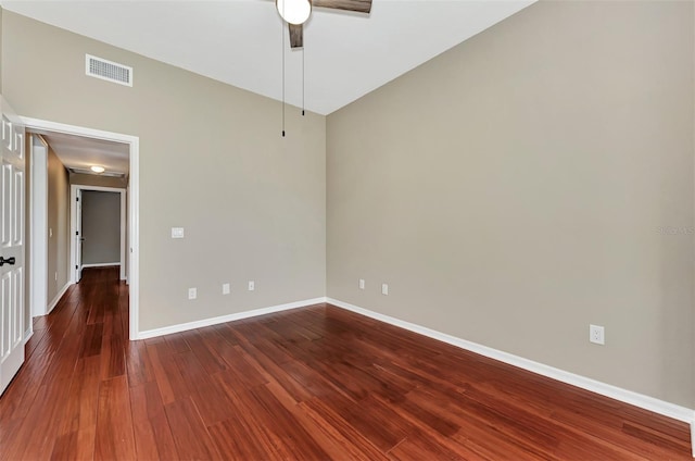 empty room featuring ceiling fan and dark hardwood / wood-style flooring