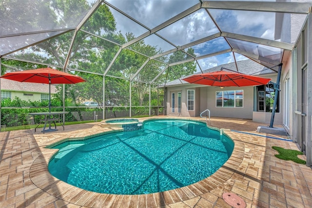 view of swimming pool featuring a lanai, an in ground hot tub, and a patio