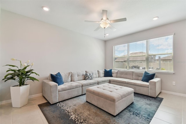 tiled living room with ceiling fan