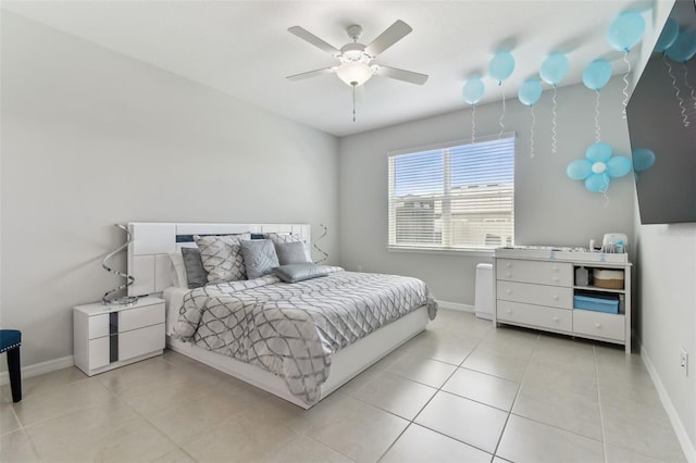 bedroom with ceiling fan and light tile floors