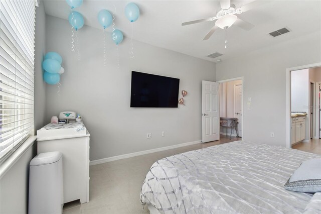 bedroom with ceiling fan and ensuite bath