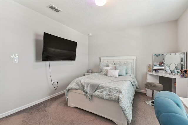 bedroom featuring dark carpet and white fridge