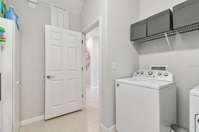 laundry room featuring washer and dryer, light tile floors, and hookup for a washing machine