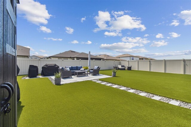 view of yard with outdoor lounge area and a patio area