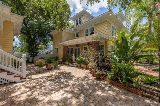 exterior space featuring ceiling fan and a patio area