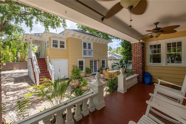 wooden deck featuring ceiling fan