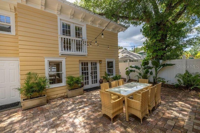 rear view of house featuring french doors and a patio