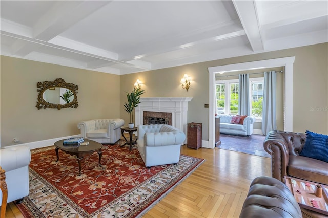 living room featuring coffered ceiling, beam ceiling, and a high end fireplace