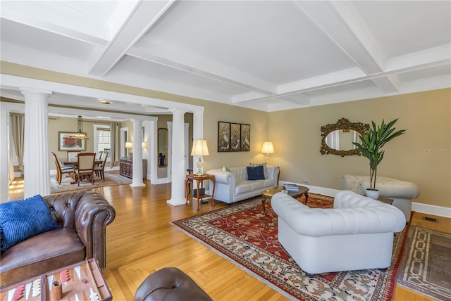 living room with hardwood / wood-style flooring, coffered ceiling, beam ceiling, and ornate columns