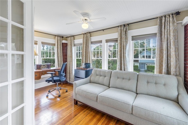 office featuring hardwood / wood-style flooring and ceiling fan