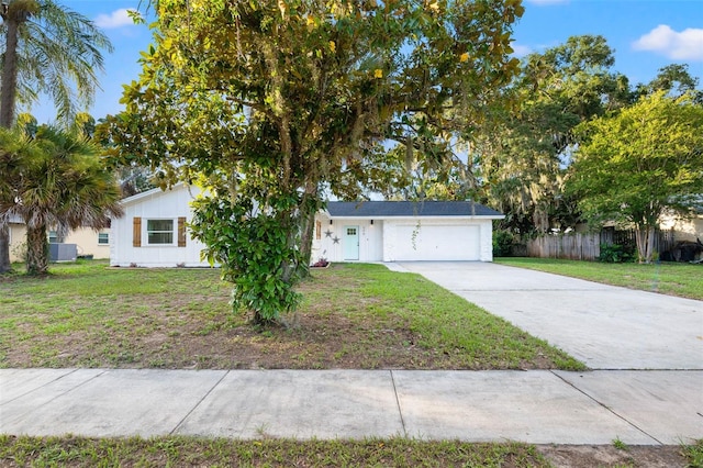 508 Brooker Rd, Brandon, FL 33511 - view of front facade with a front lawn, an attached garage, fence, and concrete driveway