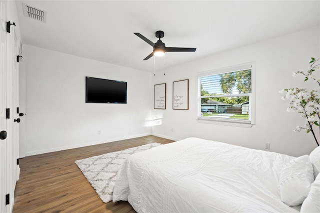 508 Brooker Rd, Brandon, FL 33511 - bedroom featuring visible vents, a ceiling fan, baseboards, and wood finished floors