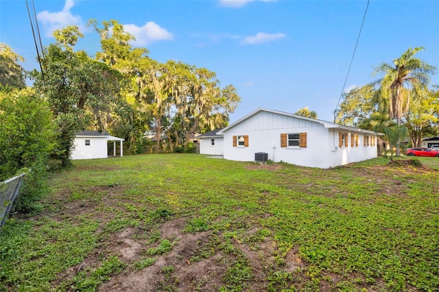 508 Brooker Rd, Brandon, FL 33511 - view of yard with central air condition unit, an outdoor structure, and fence