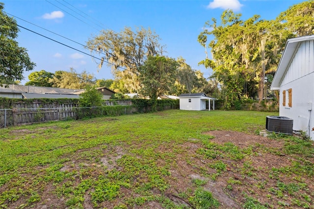 508 Brooker Rd, Brandon, FL 33511 - view of yard with a storage unit, cooling unit, an outbuilding, and a fenced backyard