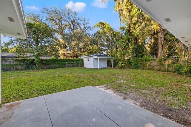 508 Brooker Rd, Brandon, FL 33511 - view of yard featuring a storage shed, a patio, a fenced backyard, and an outbuilding