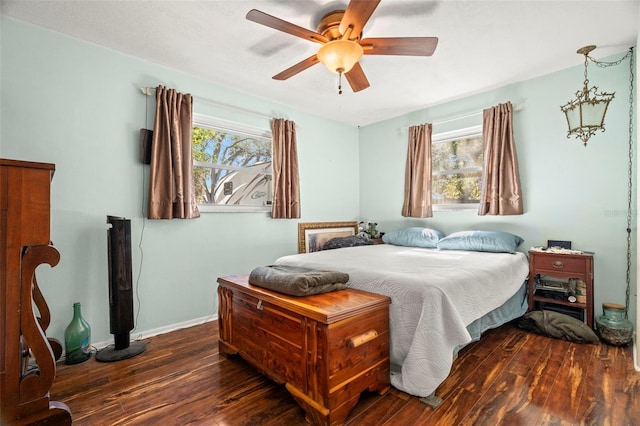 bedroom featuring dark wood-type flooring and ceiling fan