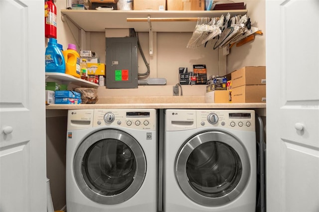 laundry area featuring electric panel and independent washer and dryer