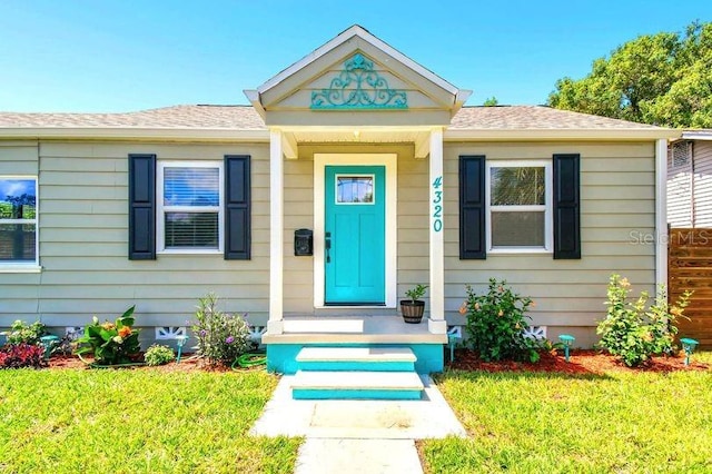 entrance to property with a yard