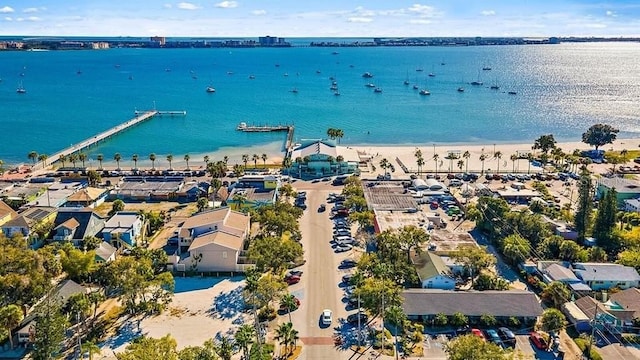 bird's eye view featuring a water view and a beach view