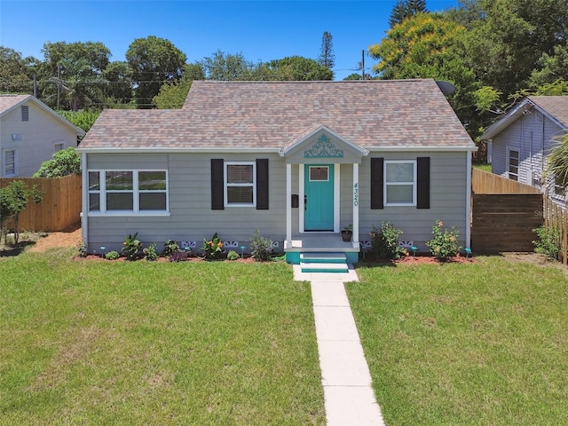 bungalow-style house with a front yard