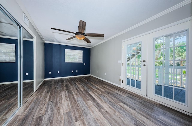 unfurnished bedroom featuring french doors, dark hardwood / wood-style flooring, ceiling fan, and crown molding