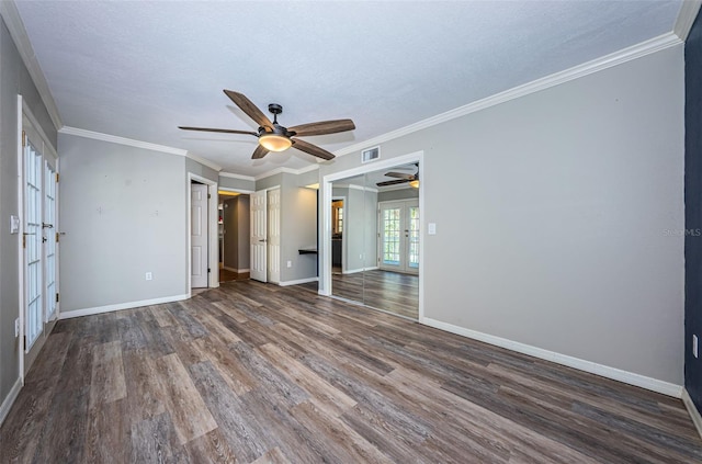 unfurnished bedroom featuring french doors, ceiling fan, ornamental molding, a textured ceiling, and dark hardwood / wood-style flooring