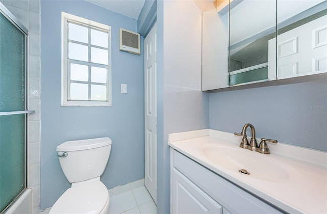 full bathroom with a wealth of natural light, tile patterned flooring, a textured ceiling, and toilet