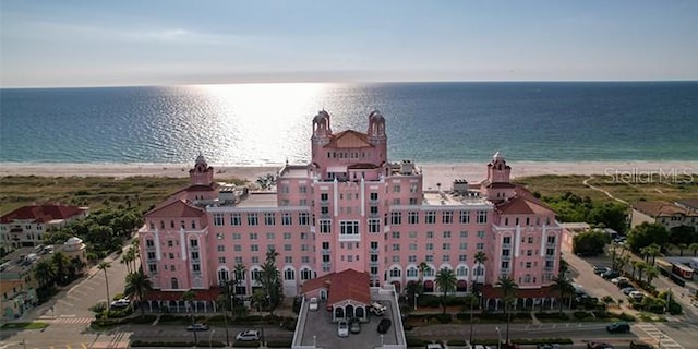 birds eye view of property featuring a water view and a beach view