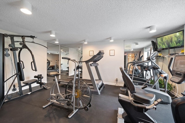 exercise room with a textured ceiling