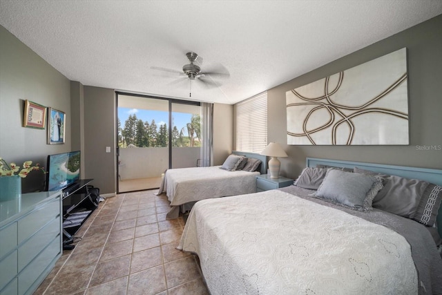 bedroom featuring ceiling fan, a textured ceiling, access to exterior, and tile patterned floors