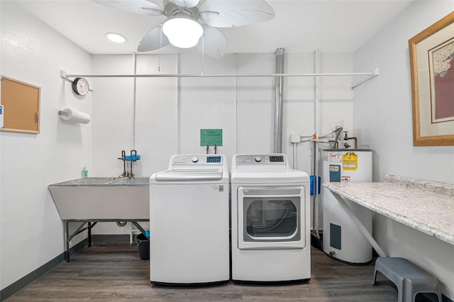 laundry area featuring electric water heater, washer and clothes dryer, ceiling fan, and hardwood / wood-style floors